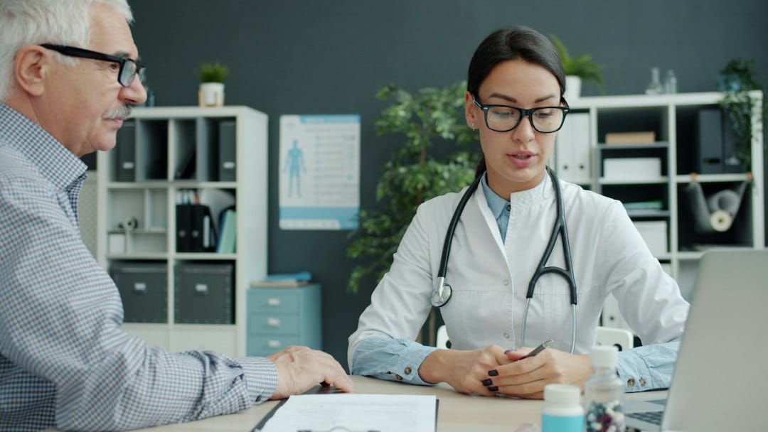 Doctor discussing healthcare with an older patient